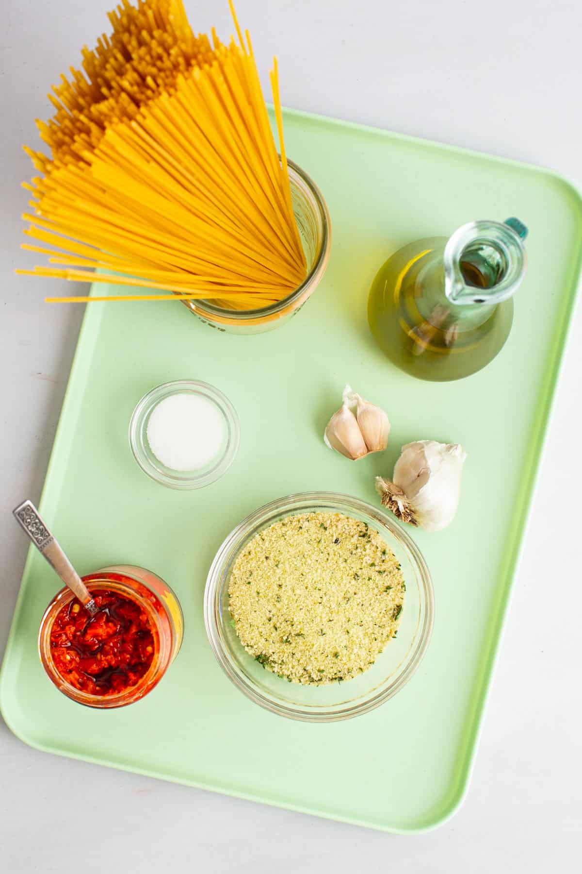 Ingredients for Spaghetti with Garlic and Oil on a tray.