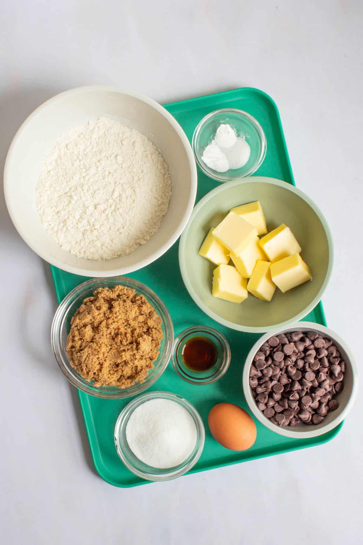 Ingredients for small-batch chocolate chip cookies on a tray.