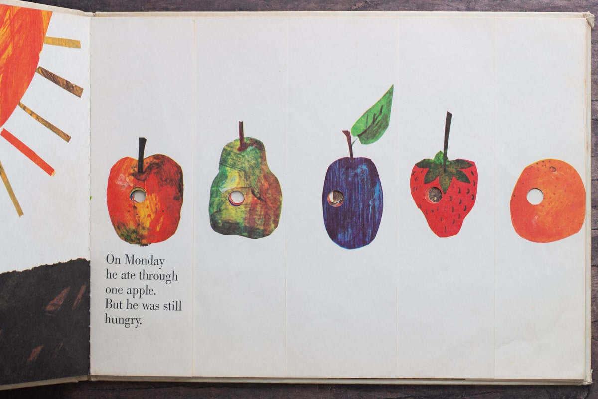 An inside book page from The Very Hungry Caterpillar showing illustrations of fruits.