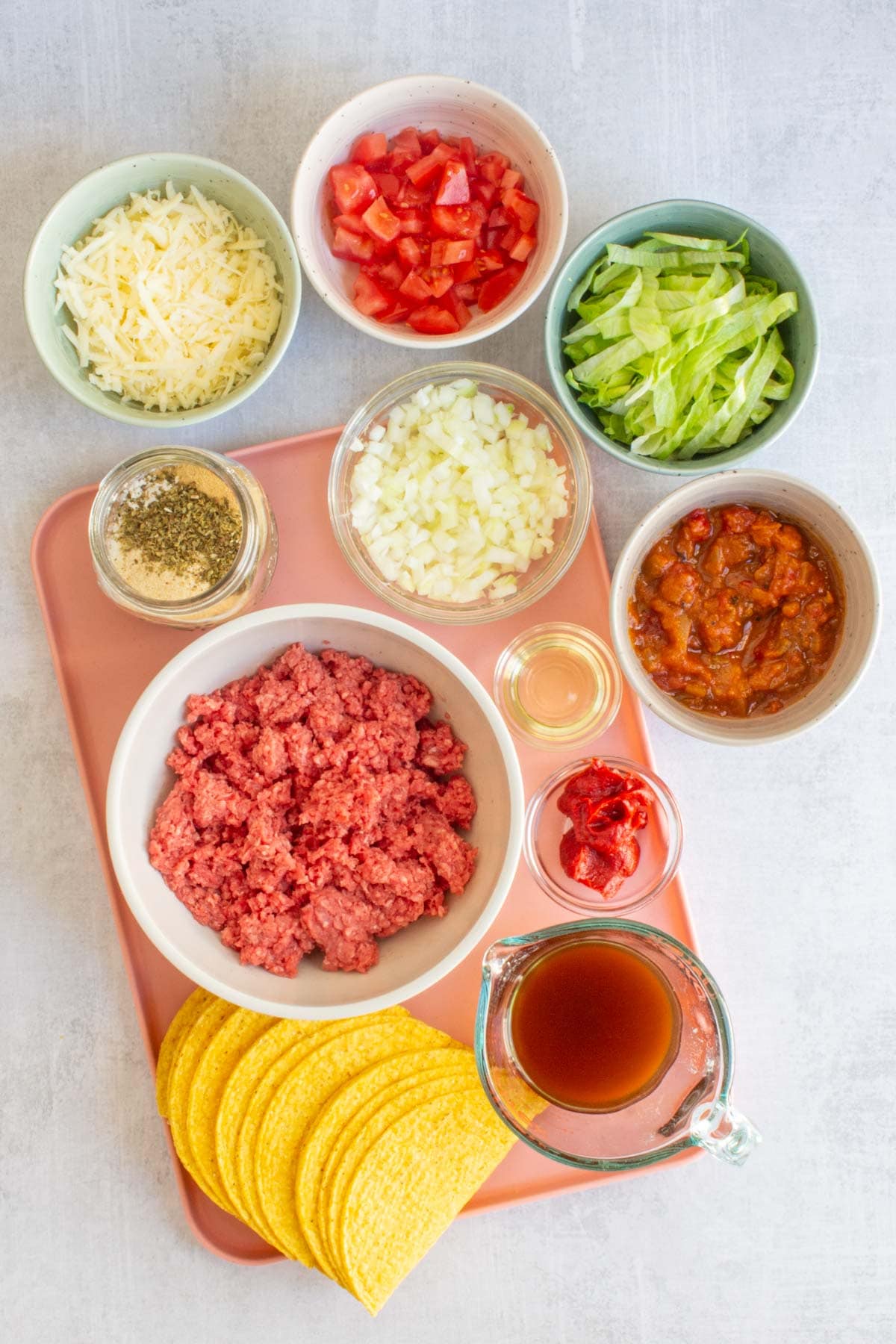 Ingredients for Ground Beef Tacos measured out on a tray.