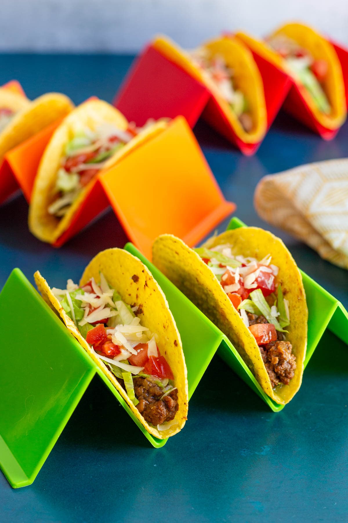 Taco holders holding assembled Ground Beef Tacos.