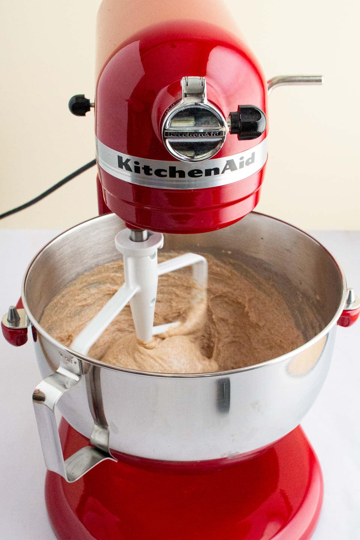 Dough for Easy Honey Wheat Sandwich Bread mixing in a stand mixer.