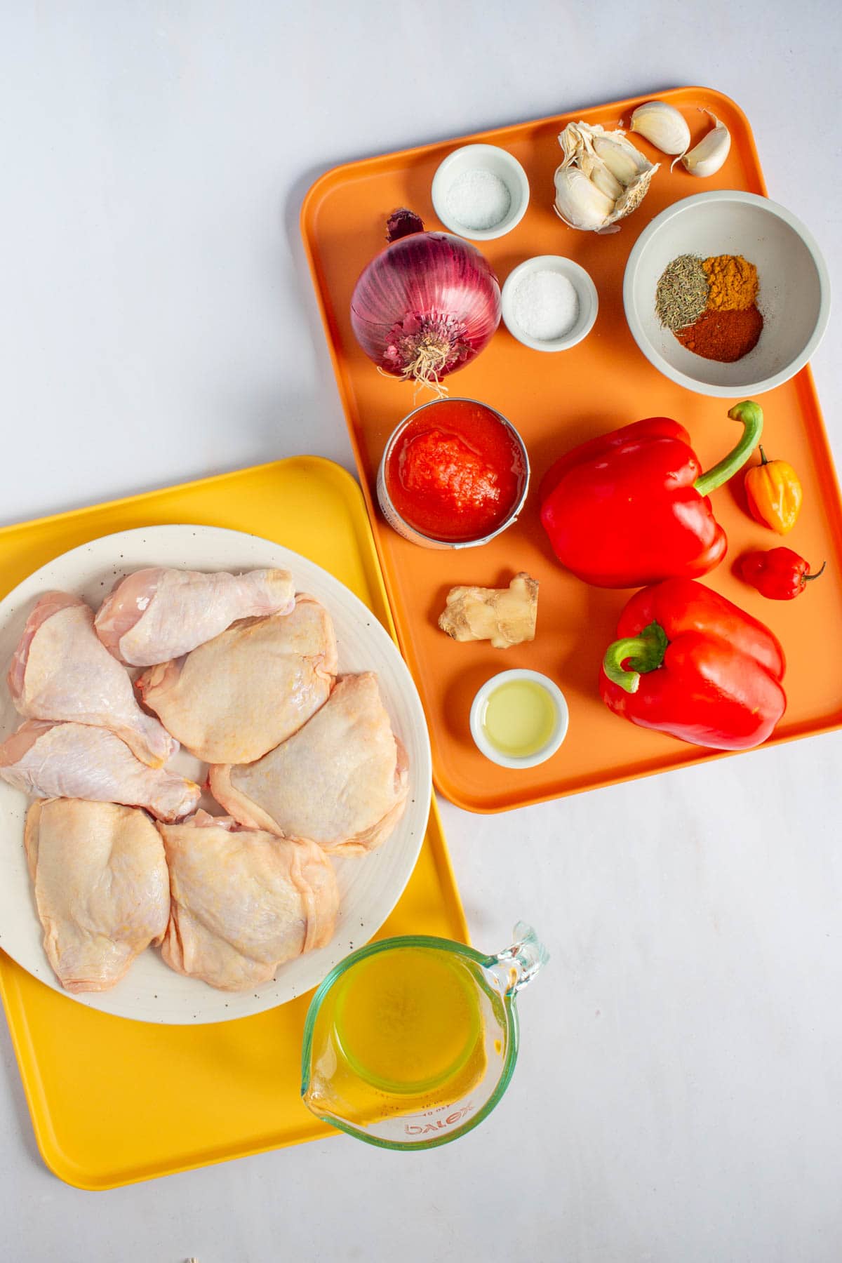 Ingredients for Nigerian Red Stew on two serving trays.