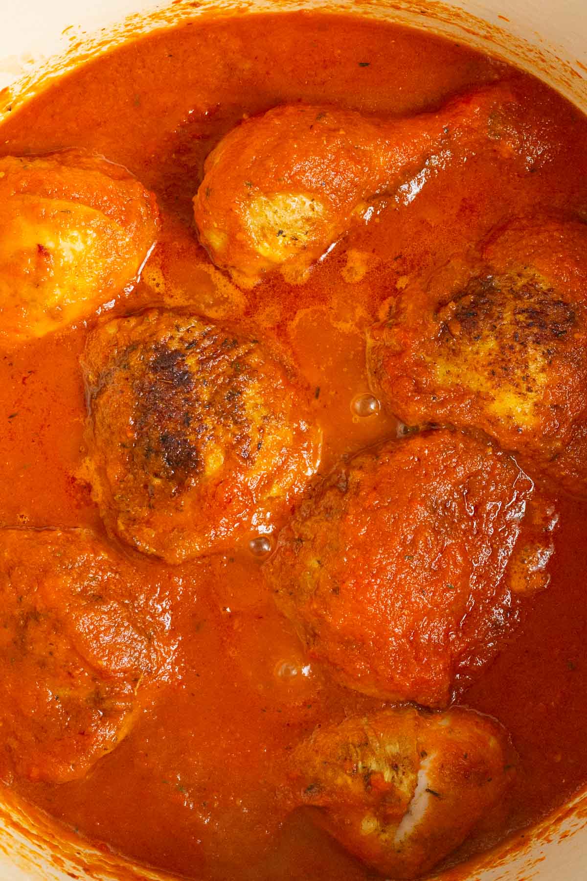 A pot of bubbling Nigerian Red Stew with Chicken.