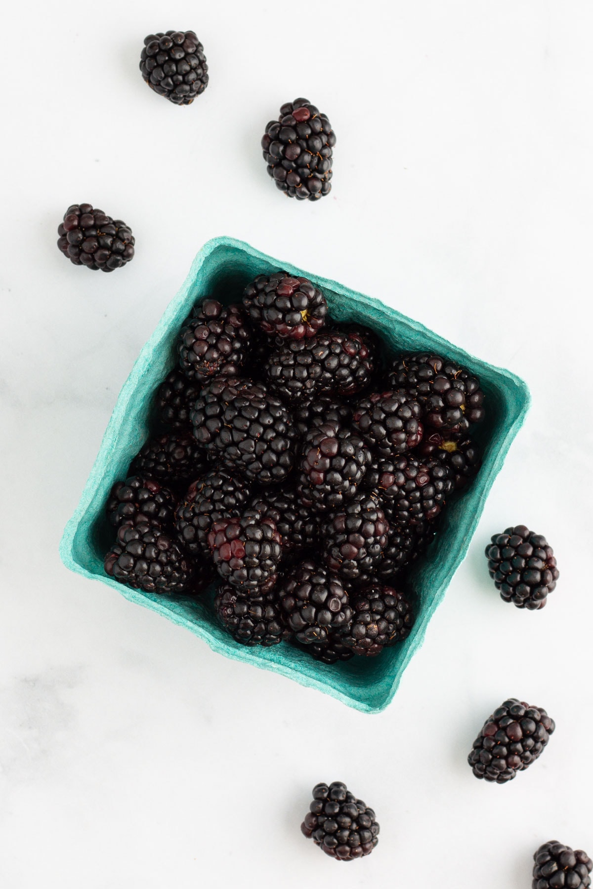 Fresh blackberries in a berry box.