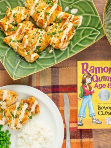 The cover of the book "Ramona Quimby, Age 8" next to a plate and a platter of Juicy Yogurt-Baked Chicken.