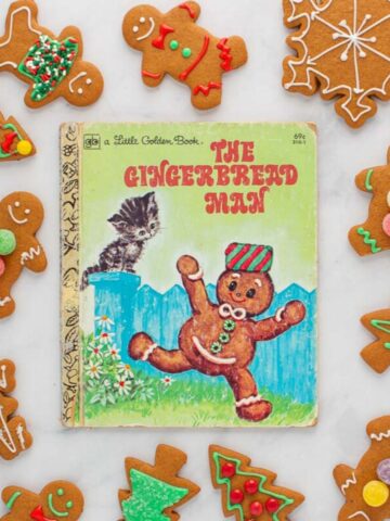 The cover of the book The Gingerbread Man, surrounded by baked and decorated gingerbread cookies.