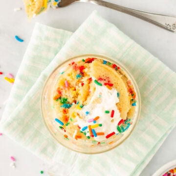 An Unbirthday Mug Cake with a bite taken out of it.