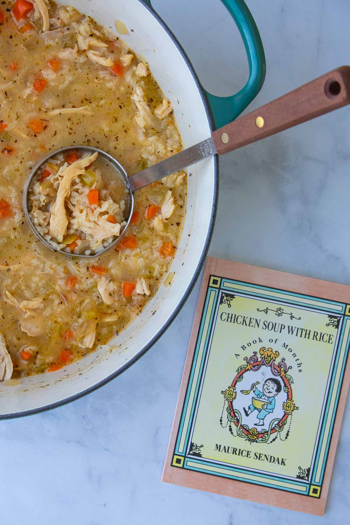 The cover of the book Chicken Soup with Rice next to a pot of chicken soup with a ladle.
