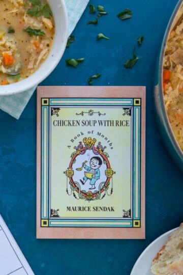 The cover of the book Chicken Soup with Rice next to a bowl and pot of chicken soup, with a calendar and bread on the side.
