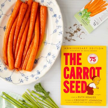 The cover of the book The Carrot Seed next to a platter of honey roasted carrots and a packet of carrot seeds.