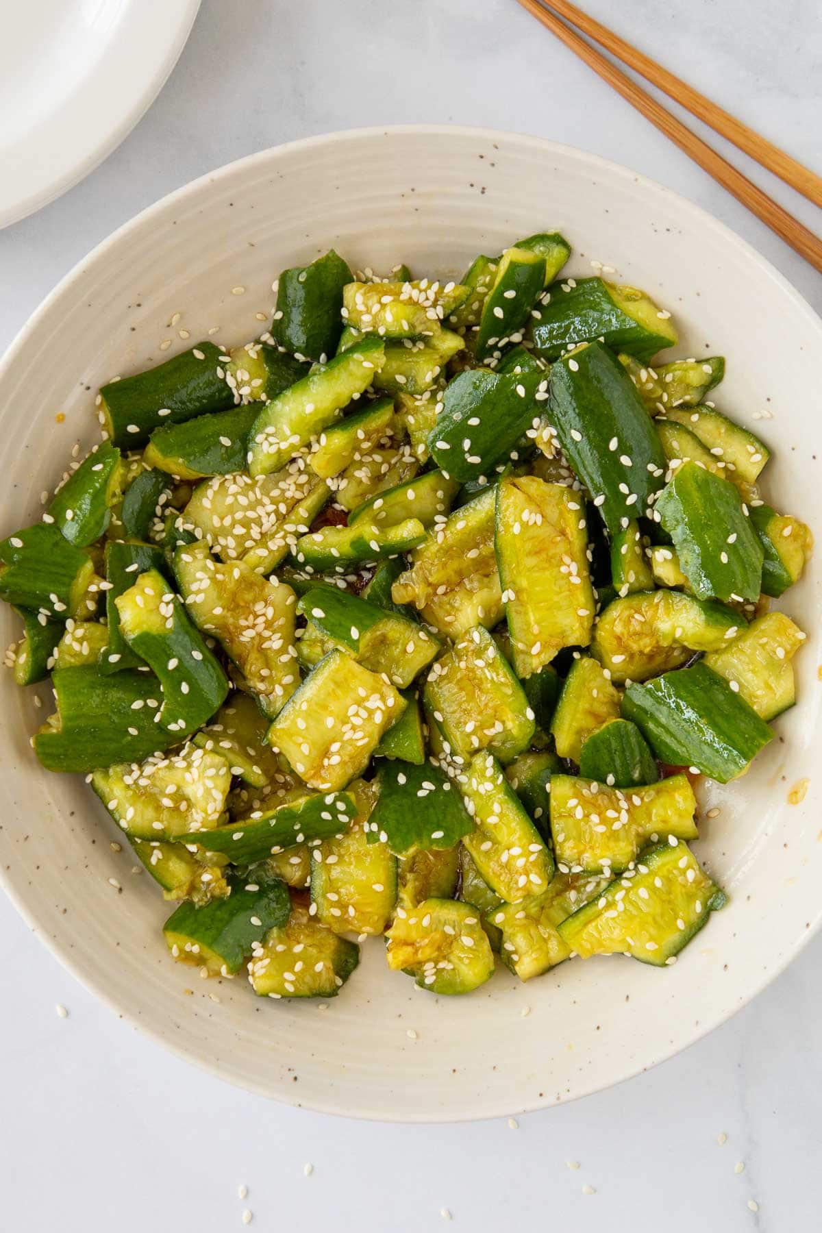 Smashed cucumber salad in a serving bowl.