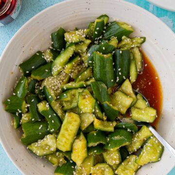 Smashed cucumber salad in a serving bowl.