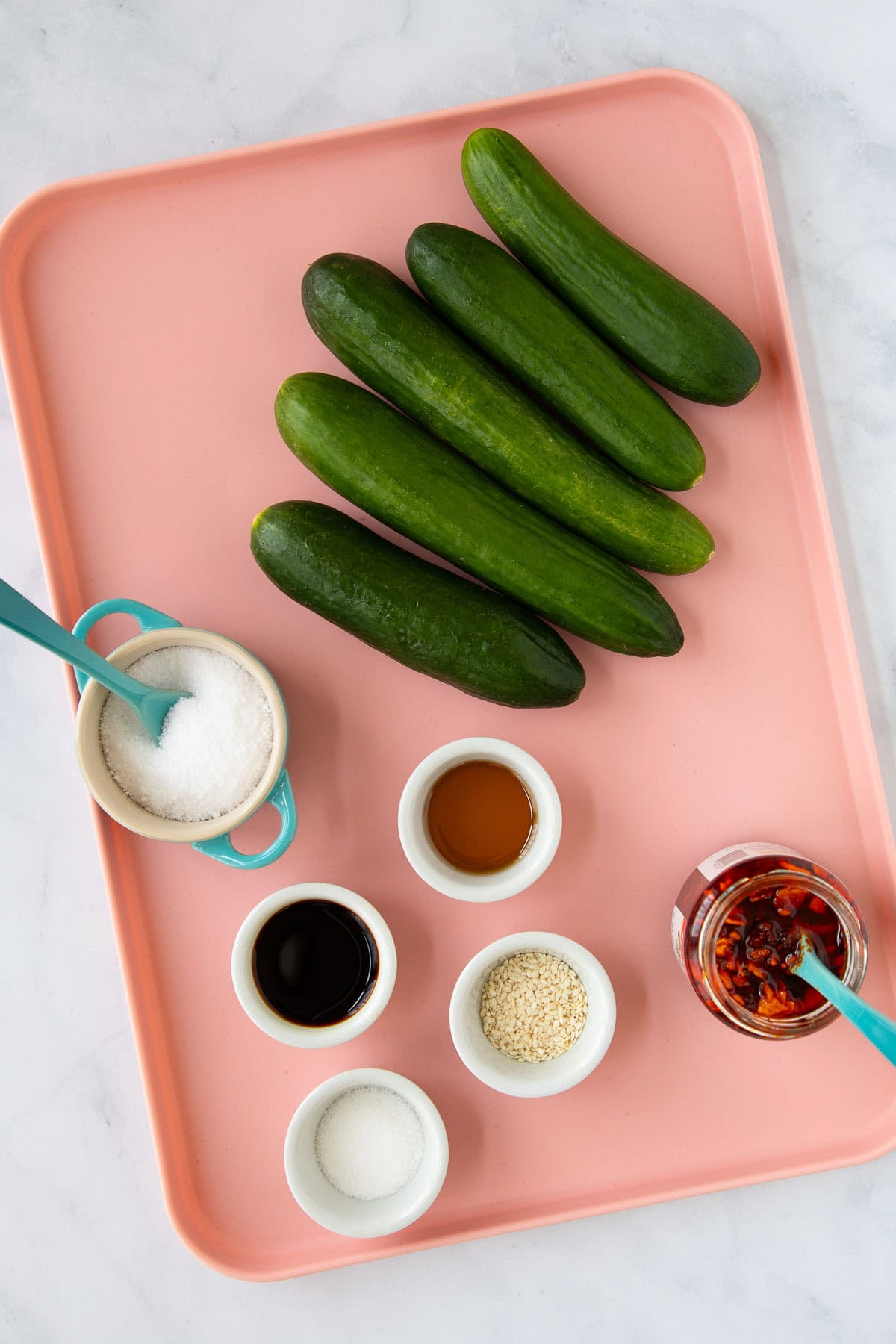 Ingredients for Smashed Cucumber Salad measured out on a tray.