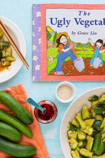 The cover of the book The Ugly Vegetables, with a bowl and plate of smashed cucumber salad, a jar of chili crisp, and a pile of cucumbers nearby.